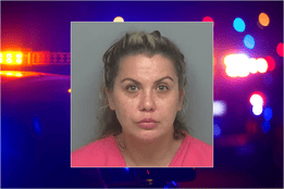 Mugshot of Michelle Davis King over a blurred background of flashing police lights. She is charged in Texas with operating an unlicensed medical spa and performing illegal cosmetic injections.