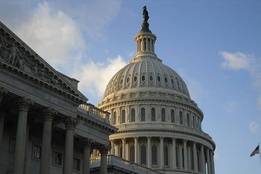 Silhouette of US capitol building at dusk