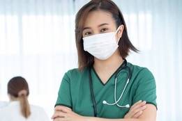 Young nurse in hospital wearing face mask