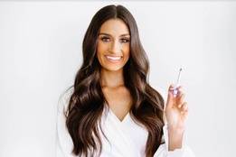 Healthcare professional holding needle