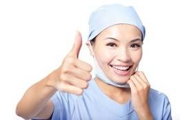 Healthcare worker wearing ppe and smiling