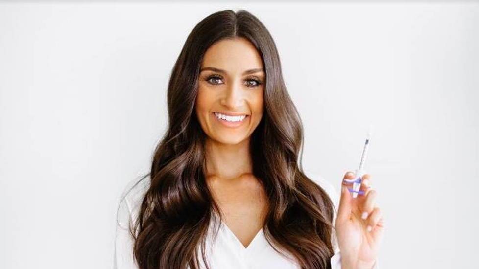 Healthcare professional holding needle