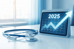 A blue stethoscope rests on a white desk next to a calendar displaying "2025" with an upward-trending arrow graph, symbolizing the growing demand and positive outlook for the healthcare job market.