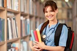 Nurse student in library with backpack and books