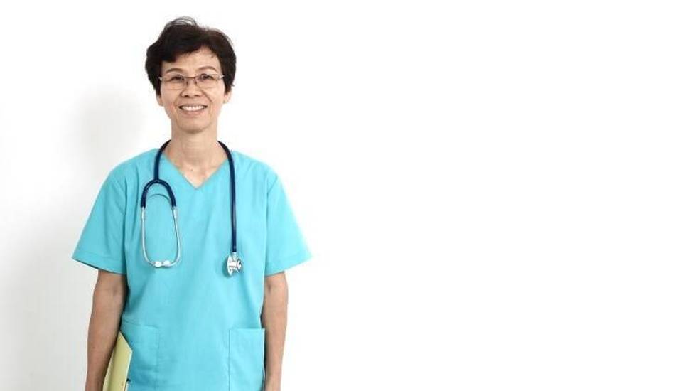 Older nurse holding folder