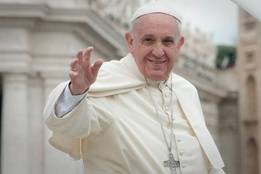 Pope Francis greeting people at the Vatican