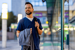 travel nurse walking into hospital