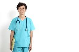 Older nurse holding folder